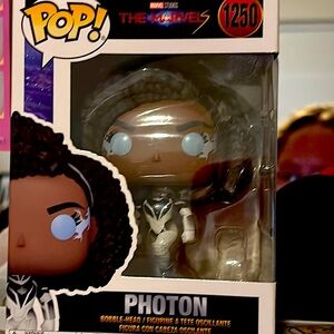 Tall aqua green lava lamp and a funky pop is a super hero